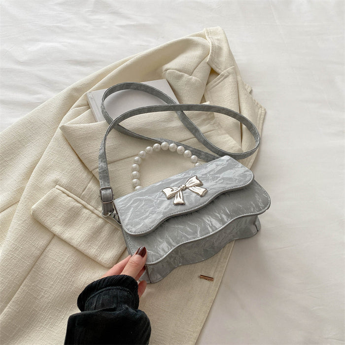 Wholesale Fashionable pearl handbag, crossbody, stylish design, butterfly texture small square bag