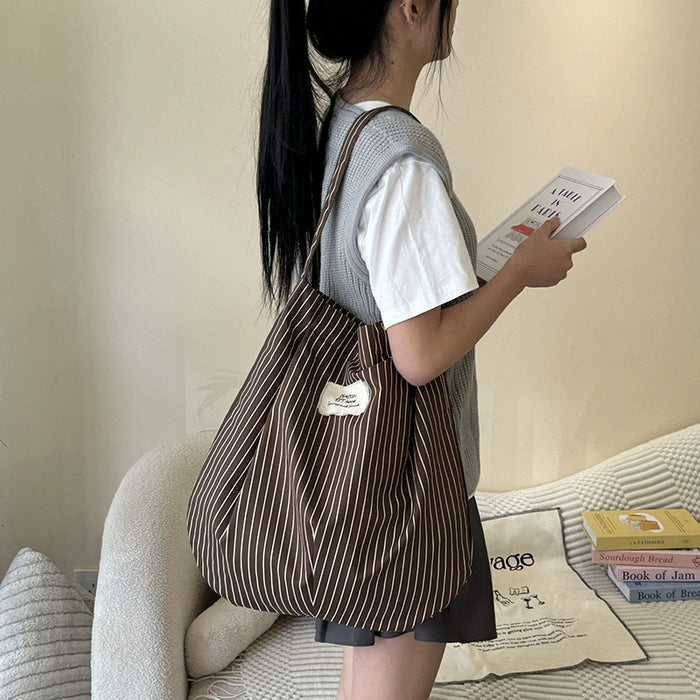 Wholesale Splicing striped canvas bag with simple temperament and large capacity commuting shoulder bag