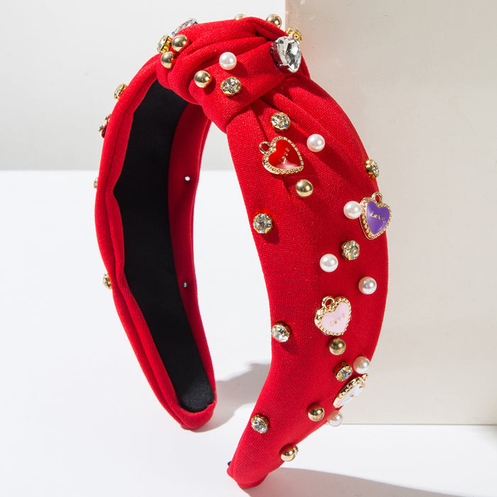 Wholesale Valentine' s Day headband with pearl-encrusted alloy letter and heart-shaped embellishments
