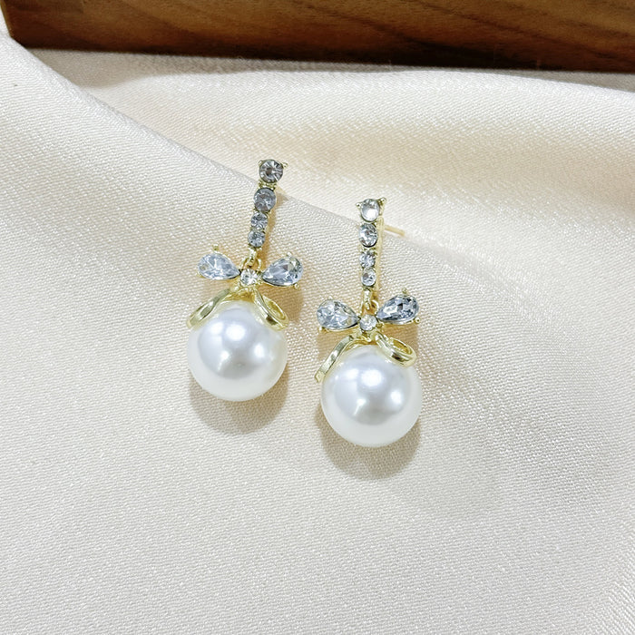 Wholesale Butterfly knot pearl pendant earrings, niche fashion, versatile design, knotted earrings