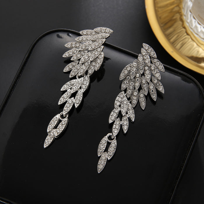 Wholesale Exaggerated earrings with fashionable tassels, long alloy and diamond studded earrings, crystal wing earrings