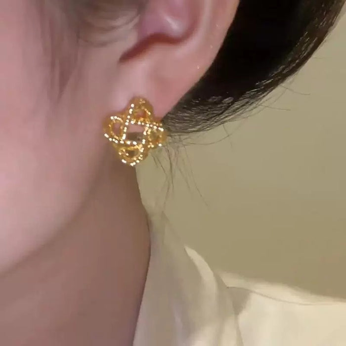 Wholesale Light luxury gold metal ear studs woven earrings with niche design earrings