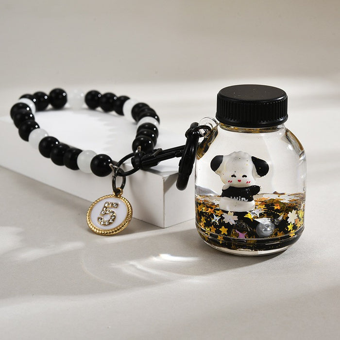 Wholesale Black and gold glitter bottle milk tea cup oil-filled acrylic keychain