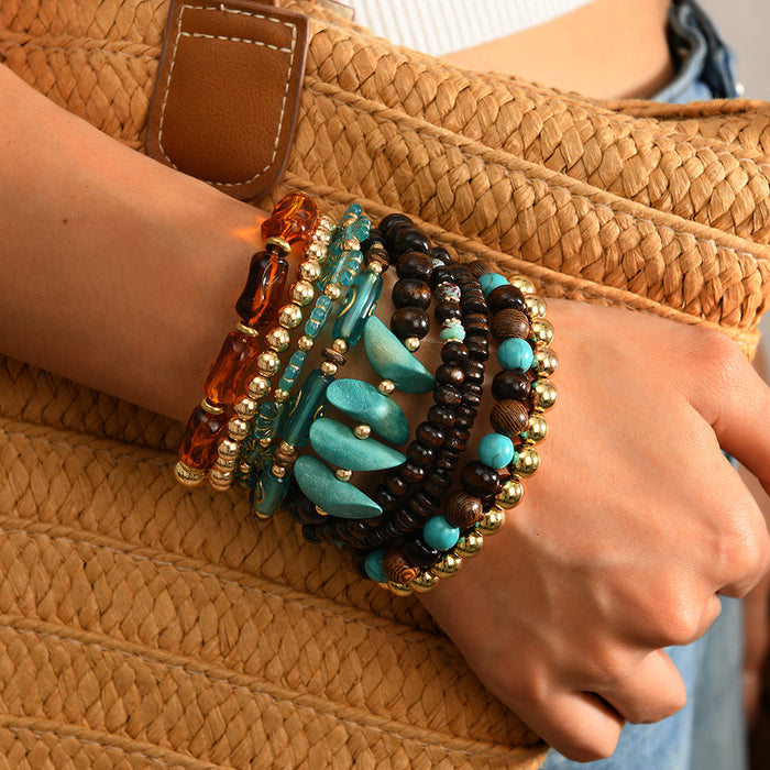 Wholesale Women' s stackable set of 9 wooden and acrylic beaded handmade bracelets.