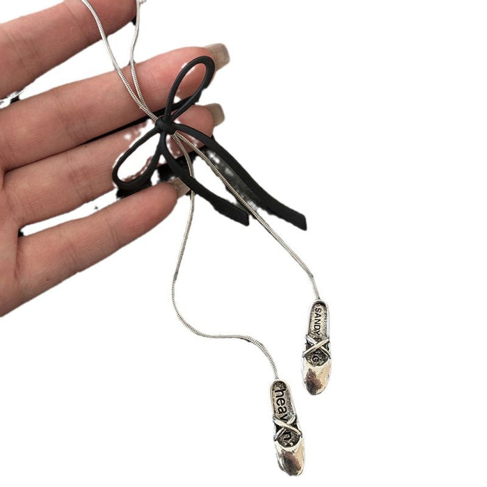 Wholesale Black bow pendant necklace with a sense of design, long sweater chain