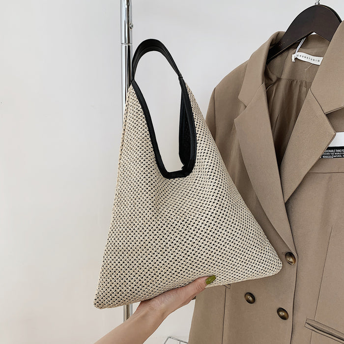 Wholesale New straw woven bag, fashionable and simple hollow shoulder bag, vacation and western-style beach bag, grass woven