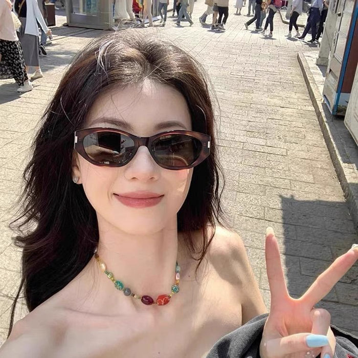 Wholesale Tea ink green sunglasses for women, round face for slimming, high-end sunglasses