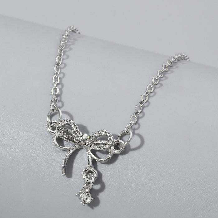 Wholesale Bow necklace, silver geometric pendant with diamond inlay design, versatile accessory