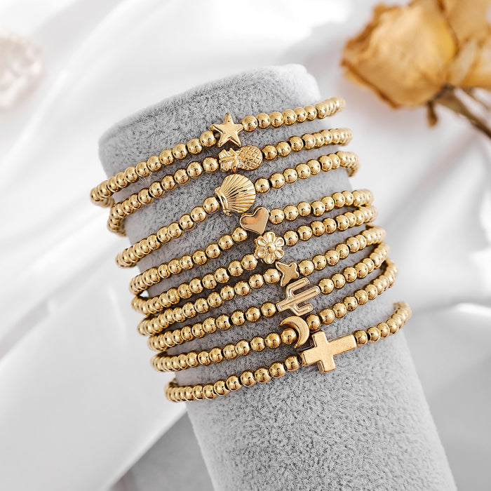 Wholesale Fashionable and minimalist bead string personalized cross flower gold bean bracelet