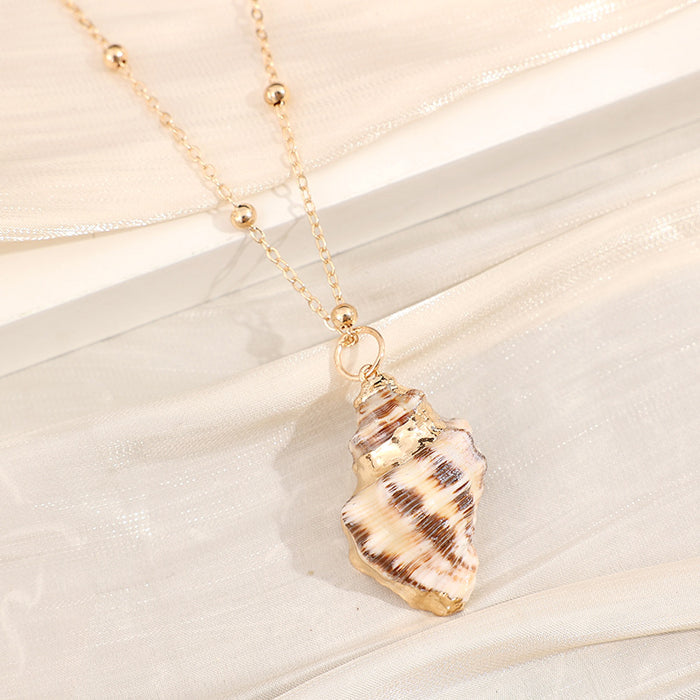 Wholesale Gold edged conch and seashell necklace