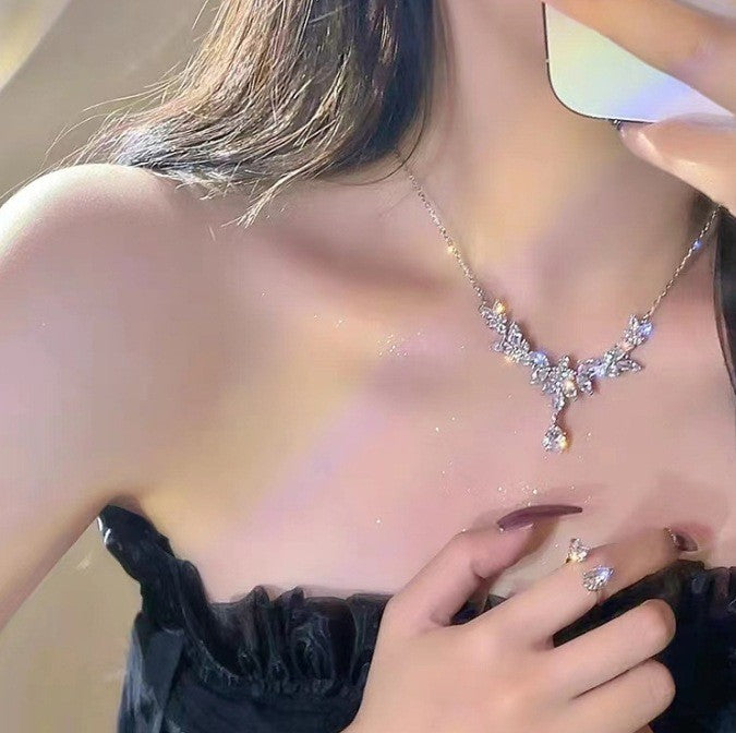 Wholesale Light luxury sparkling diamond water droplet fringe necklace, niche design, high-end temperament, versatile butterfly pendant, collarbone chain