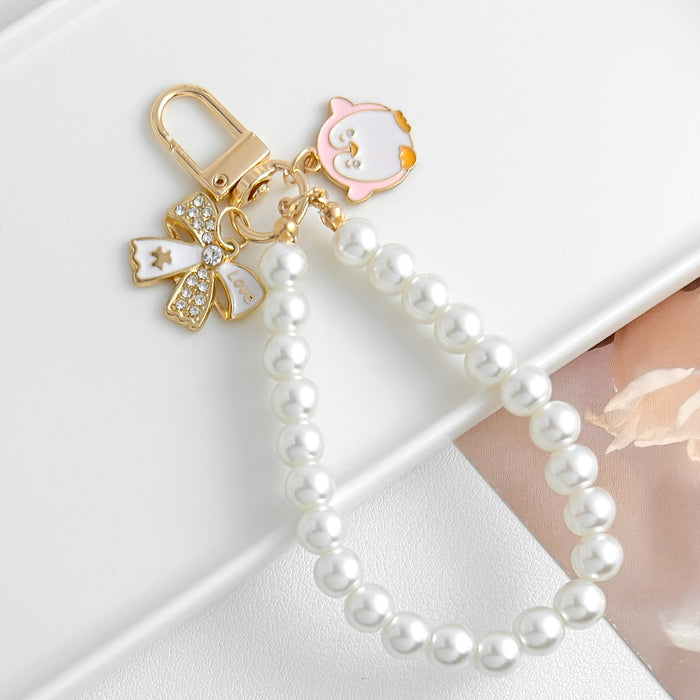 Wholesale Pearl chain beaded mobile phone lanyard bow pendant keychain