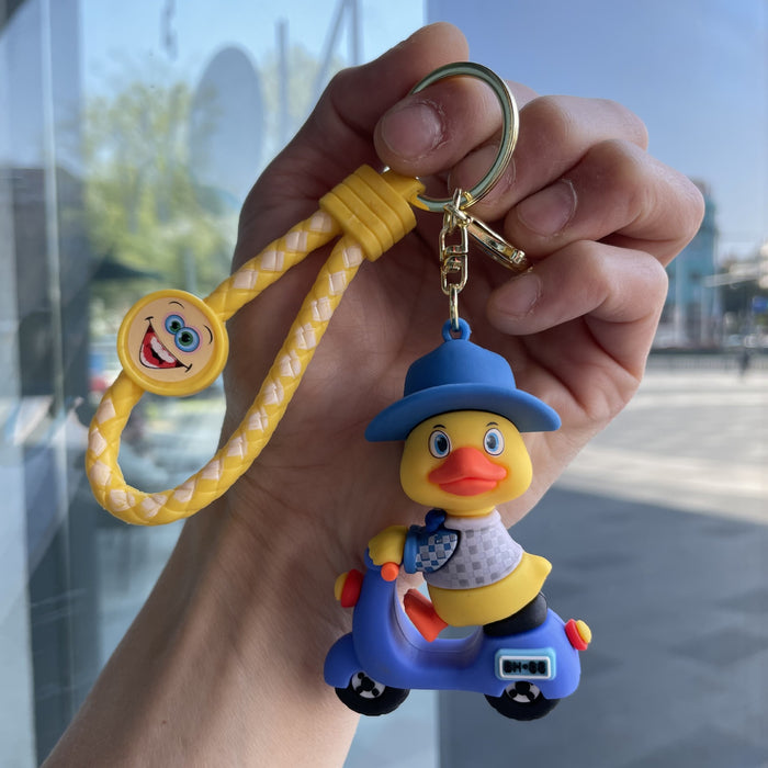 Wholesale Tram couple duck keychain couple backpack pendant claw machine doll car keychain exquisite small gift wholesale
