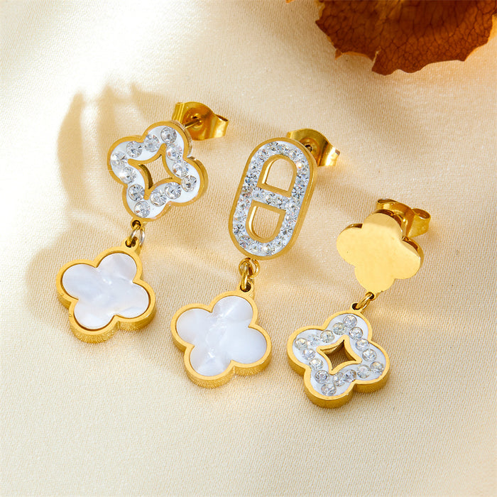 Wholesale Three four-leaf clover-shaped earrings with diamond embellishments.