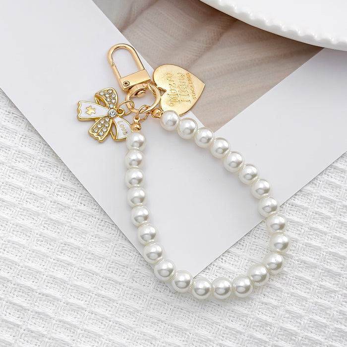 Wholesale Pearl chain beaded mobile phone lanyard bow pendant keychain