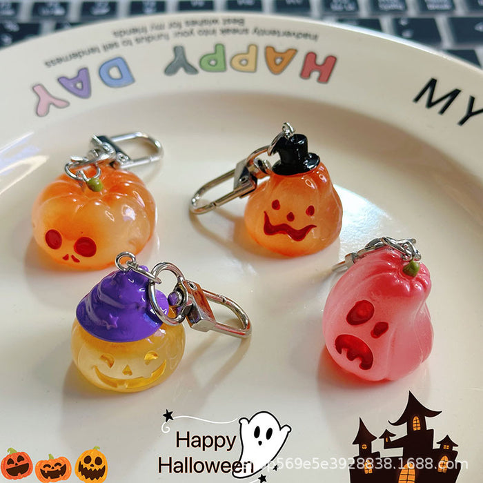 Wholesale Novelty  Pumpkin Pendant Keychain Glow In The Dark Resin Black Hat Design Bag And Earphone Case Charm Gift For Students And Couples