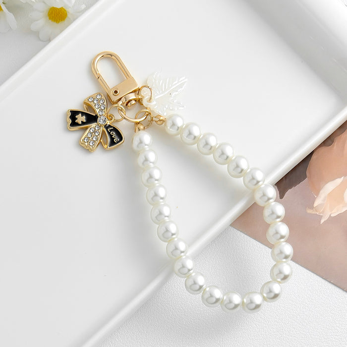 Wholesale Pearl chain beaded mobile phone lanyard bow pendant keychain