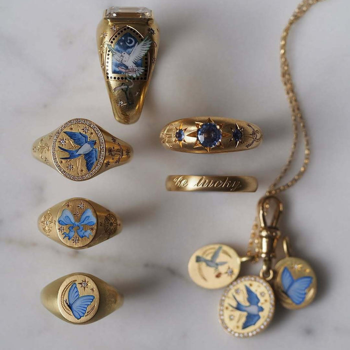 Wholesale Stainless steel pendant necklaces with various painted patterns.