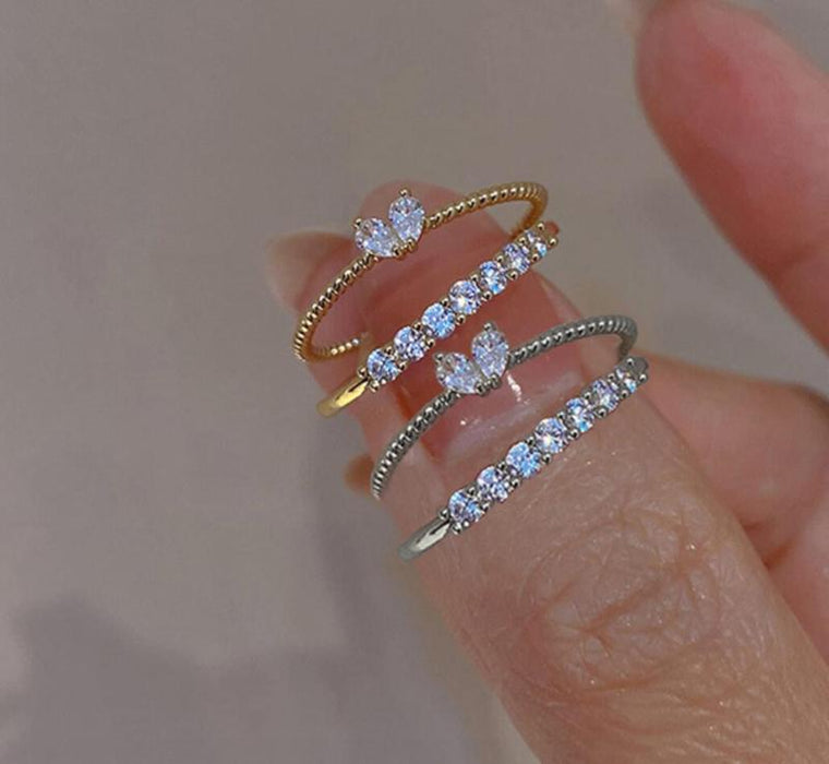 Wholesale Set of open-faced diamond-encrusted heart-shaped rings.