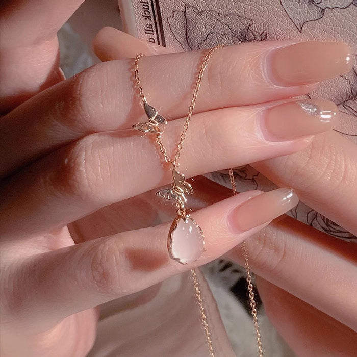 Wholesale Pure silver powder crystal droplet butterfly necklace for women, light luxury, niche, high-end design, collarbone chain