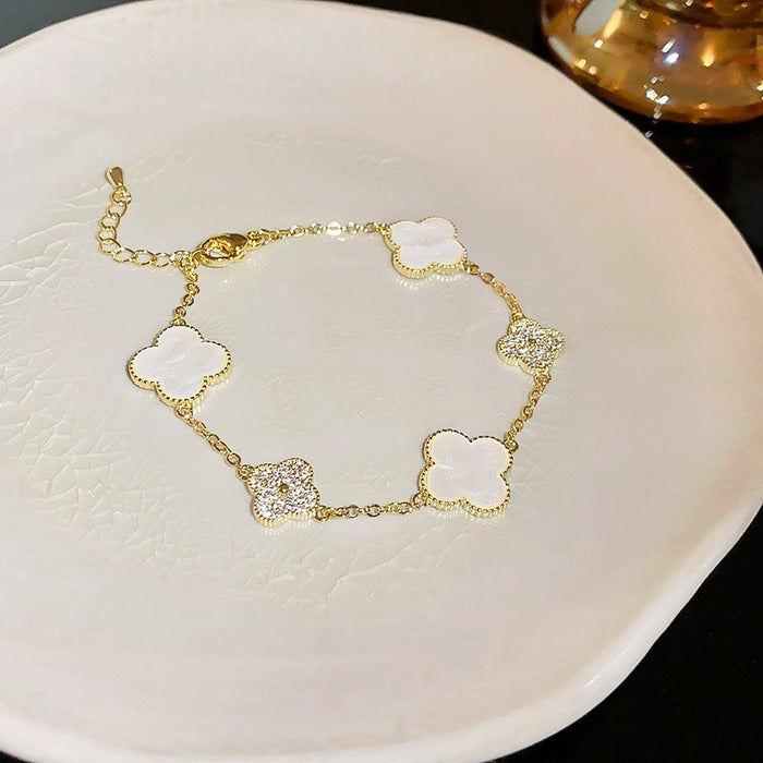 Wholesale Real Gold Electroplated Zircon Four-petal Flower Imitation Fritillaria Bracelet Light Luxury High-end Sense Bracelet Sweet All-match Bracelet Wholesale Women