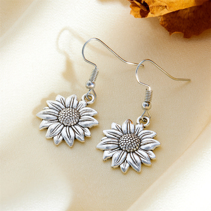 Wholesale Exaggerated gold sunflower titanium steel gold-plated earrings