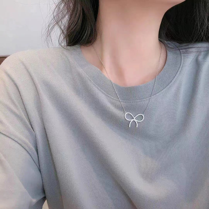 Wholesale Titanium steel necklace with high-end feel, full diamond bow pendant, light luxury, niche collarbone chain