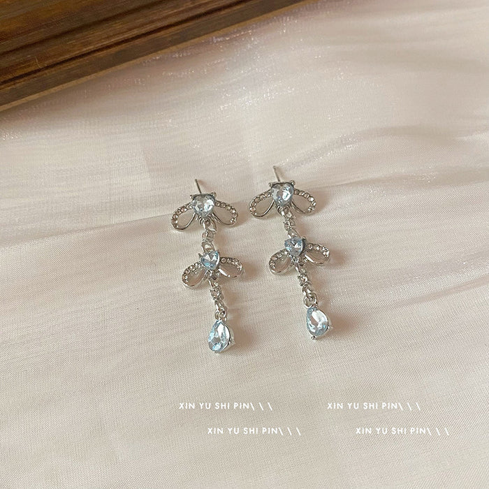 Wholesale Blue heart-shaped zircon bow earrings, niche design, exaggerated earrings, high-end water droplet pendant, long earrings