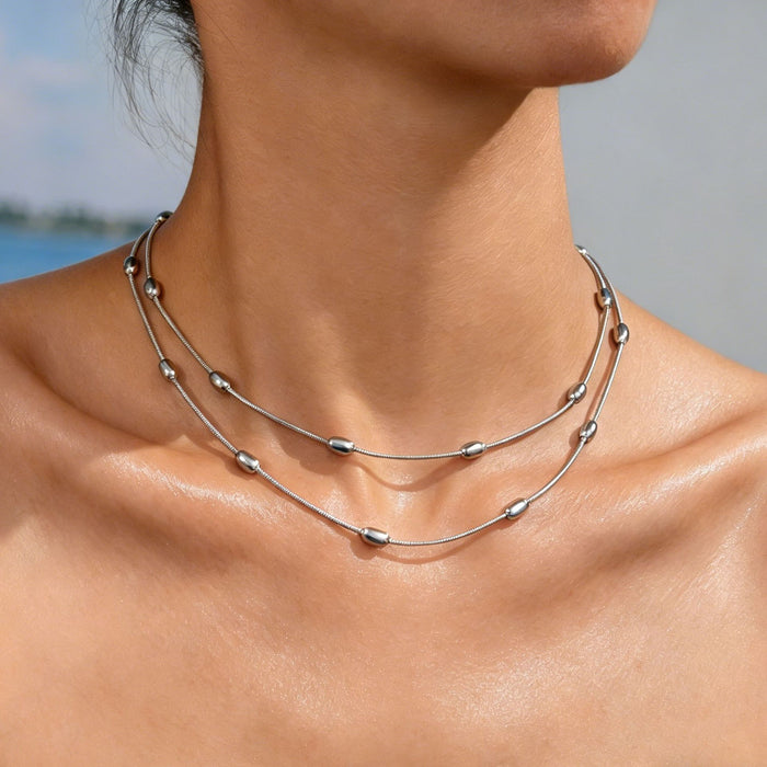 Wholesale 2pcs A luxurious double-layered gold bead snake bone necklace perfect for layering and exuding elegance