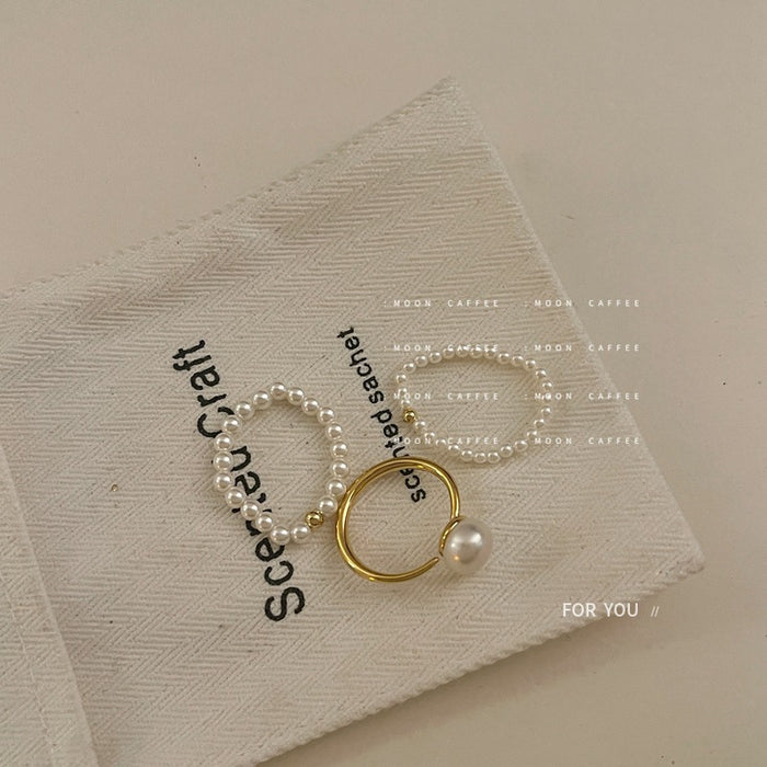 Wholesale Light luxury mini pearl bead elastic rope ring with a retro temperament that does not touch the wrist circumference, freshwater pearl ring
