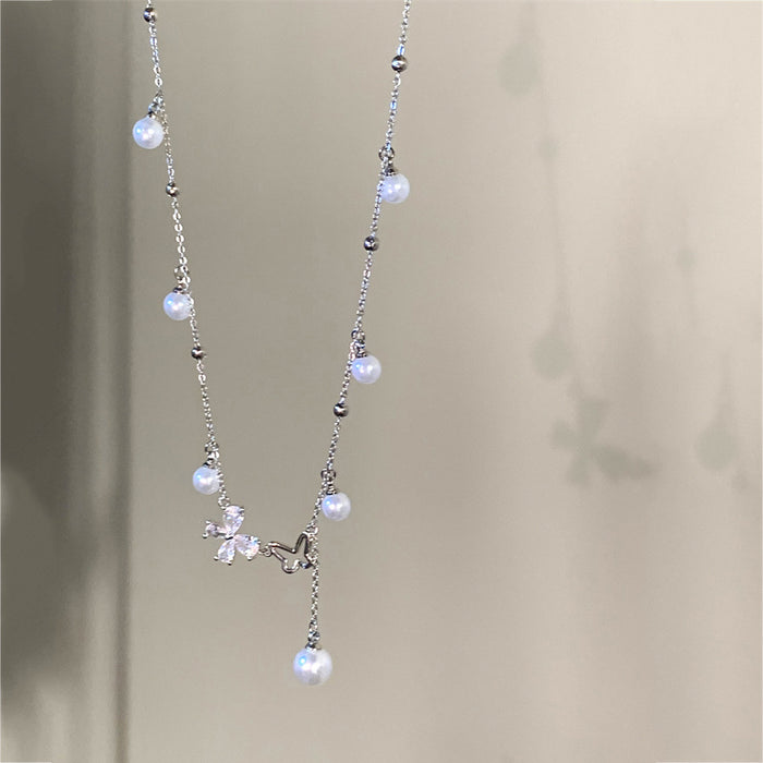 Wholesale Titanium steel non-fading zircon hollow butterfly necklace French pearl tassel clavicle chain high-end luxury accessories