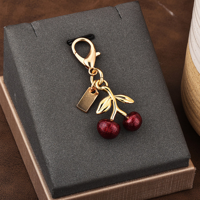 Wholesale Car key pendant high sense bag accessories gold color bear cherry four-leaf clover butterfly schoolbag jewelry