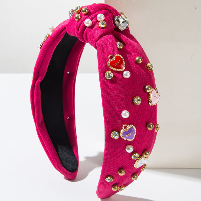 Wholesale Valentine' s Day headband with pearl-encrusted alloy letter and heart-shaped embellishments