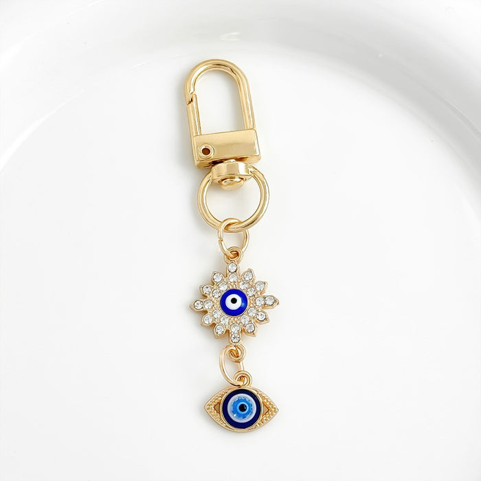 Wholesale Diamond-encrusted blue eyes evil eye tassel keychain