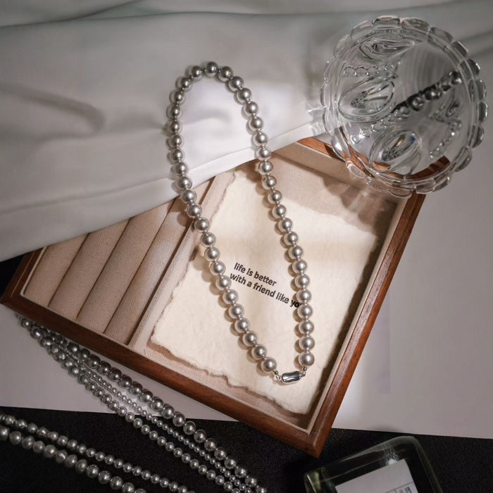 Wholesale Pearl titanium steel necklace, women's round, light luxury temperament, versatile autumn and winter sweater chain