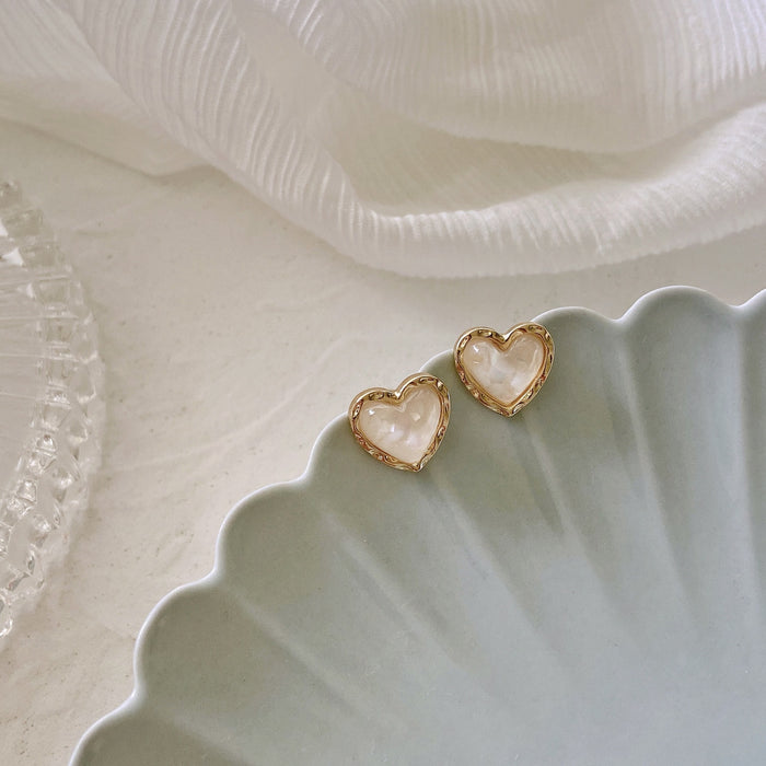 Wholesale Elegant Small White Cat Eye Heart Earrings S925 Silver Needle Earrings