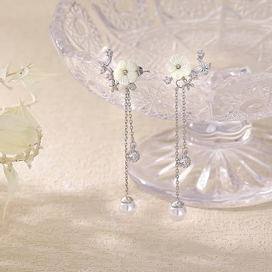 Wholesale Pure silver temperament, simple moon earrings, geometric asymmetry, long tassel pearl earrings