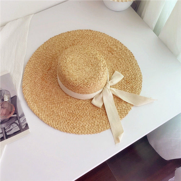 Wholesale Big brim frayed Lafite grass hat women's beach hat for beach vacation, sun protection and sunshade hat