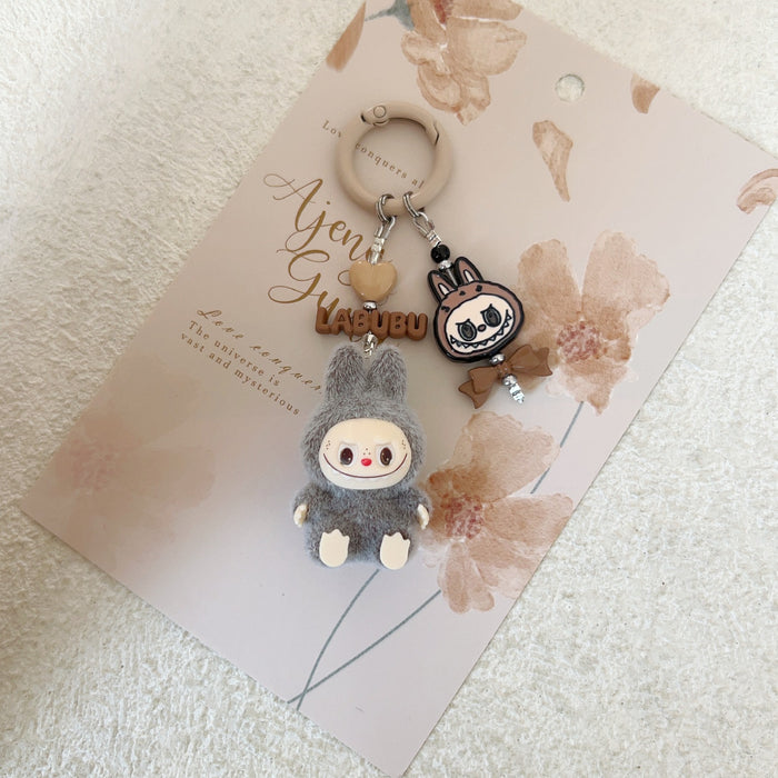 Wholesale Doll Enamel Sitting Posture Cute Mobile Phone Pendant Keychain