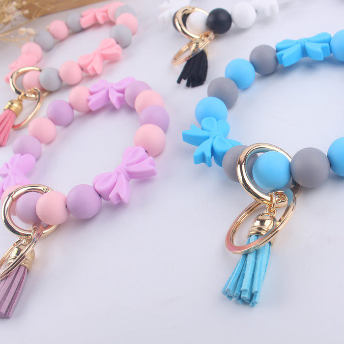 Wholesale PU Cartoon Bowknot Silicone Handmade Beaded Wrist Keychain JDC-KC-GuangTian006