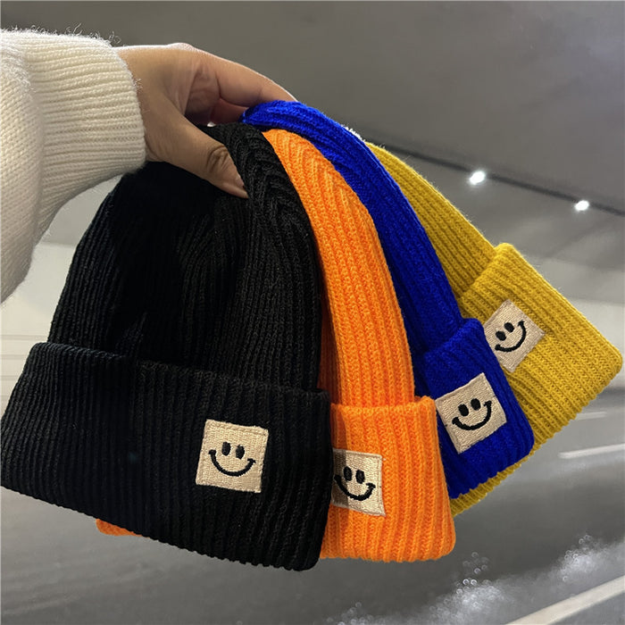 Wholesale Autumn and Winter Cute Smiley Face Logo Wool Knitted Hat JDC-FH-Yizhan002