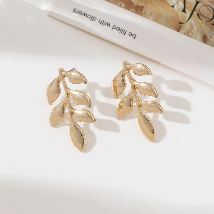 Wholesale Alloy leaf shaped hollowed out earrings metal stud earrings
