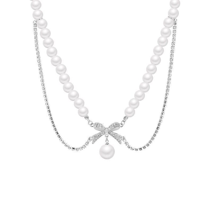 Wholesale A niche retro bow pearl necklace with diamond inlay, simple and elegant temperament