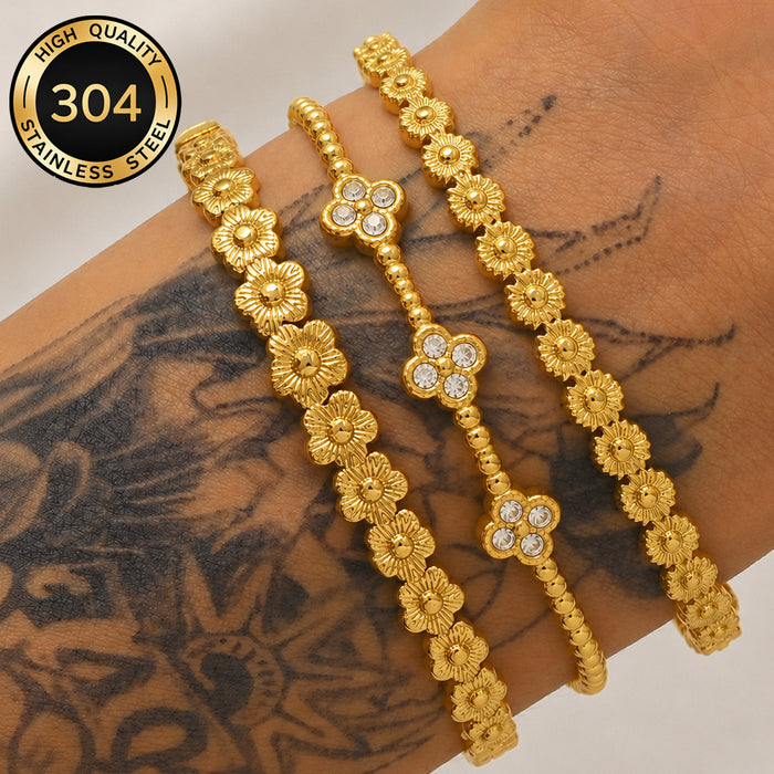 Wholesale Women S Titanium Steel Bracelet Featuring Three Flowers Four Leaf Clover With Electroplated Finish For Everyday Fashion Accessory