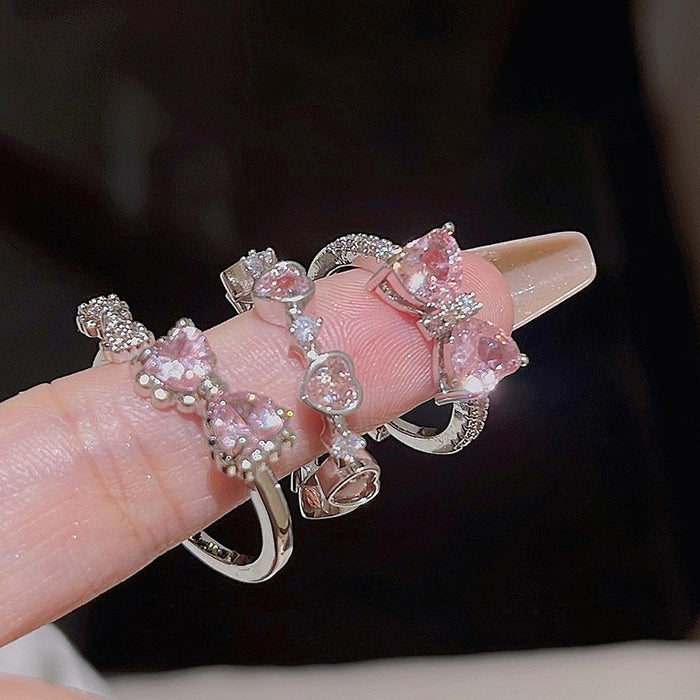 Wholesale Set of open-faced diamond-encrusted heart-shaped rings.