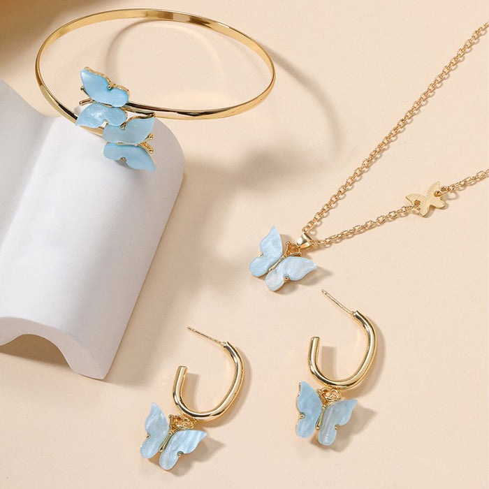 Wholesale Versatile alloy butterfly earrings, bracelets, necklaces, four piece jewelry pendant set