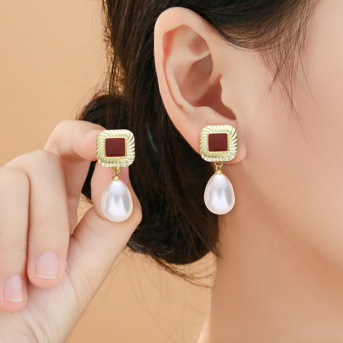 Wholesale Geometric pearl earrings temperament hollow round teardrop-shaped pearl earrings