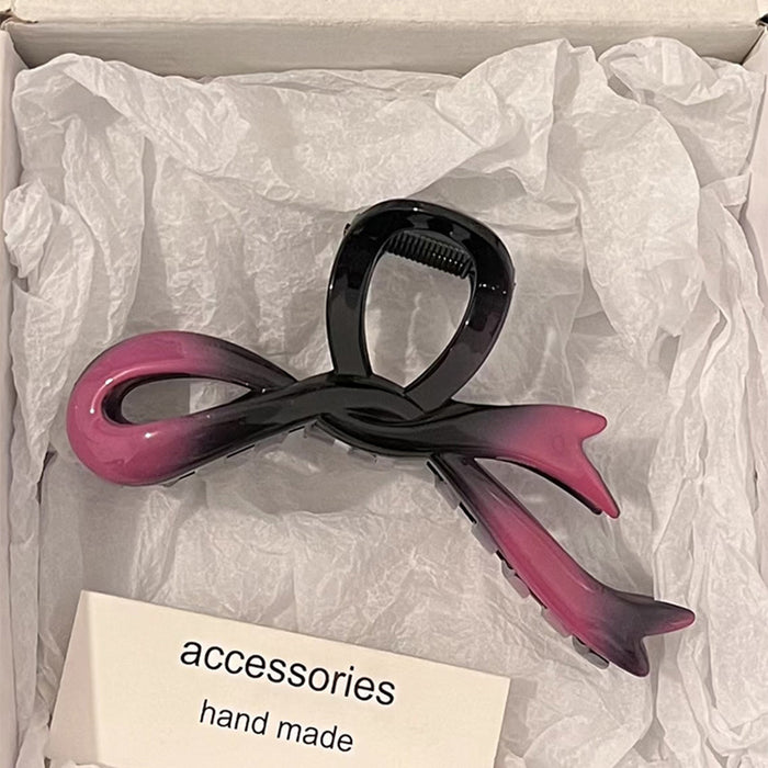 Wholesale Bow shaped acrylic hair clip for women's hair accessories with a high-end feel. Back of the head hair clip with a large shark clip