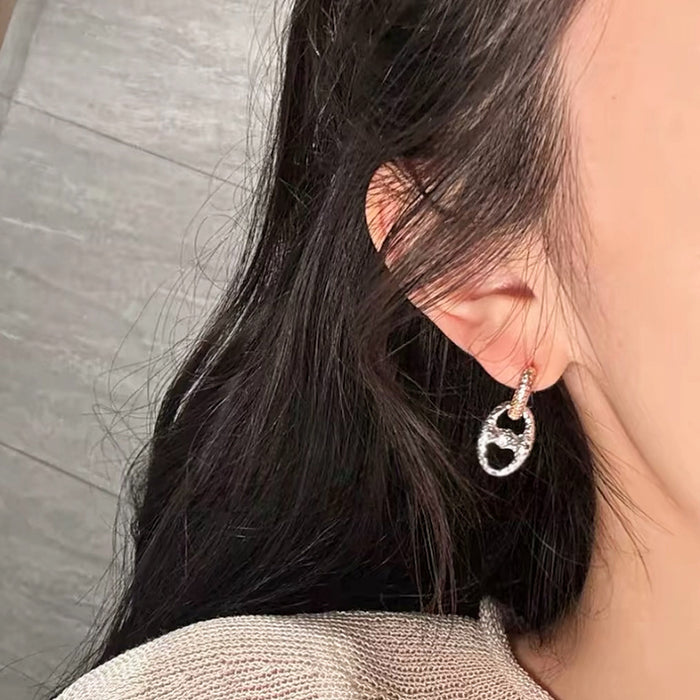 Wholesale 24K gold electroplated pig nose earrings with strong color retention,  luxurious and high-end feel,  CNC-machined delicate round two-tone earrings.