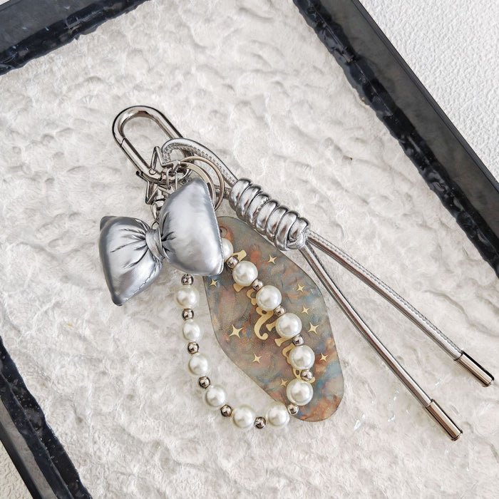 Wholesale Simple Bow Woven Leather Rope Pearl Chain Hanging Keychain